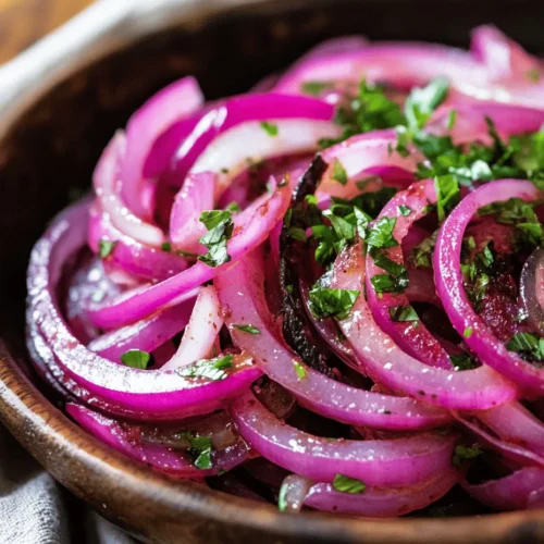 Red onions are at the heart of this recipe, delivering not just flavor but also a vibrant burst of color. Their mild yet slightly sweet taste makes them an ideal choice for raw preparations; they maintain a crunch while adding a lovely depth to cooked dishes. Nutritionally, red onions are packed with antioxidants, particularly quercetin, which is known for its anti-inflammatory properties. They also contain beneficial compounds that can support heart health and improve digestive function.