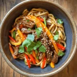 Hoisin Beef Noodles is a delightful dish that brings together a medley of rich flavors and textures, making it a beloved choice for many. With its combination of tender beef, vibrant vegetables, and flavorful noodles, this dish is not only satisfying but also quick to prepare—ideal for busy weeknights or when hosting guests for a special occasion. Asian-inspired noodle dishes like Hoisin Beef Noodles have gained immense popularity due to their versatility, allowing for endless customization based on personal tastes and dietary preferences.