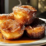Filling the muffin tin is a crucial step in making your Cinnamon Sugar French Toast Muffins. Start by preheating your oven to 350°F (175°C) to ensure it’s hot and ready for baking. When it comes to portion sizes, a standard muffin tin typically holds about 1/4 to 1/3 cup of batter per muffin. Using an ice cream scoop or a measuring cup can help you achieve consistent portions, preventing mess and ensuring even baking.