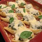 If you’re looking for a comforting and delicious dish that brings a taste of Italy to your dining table, look no further than Easy Spinach and Ricotta Stuffed Shells. This delightful recipe features large pasta shells filled with a creamy mixture of ricotta cheese, fresh spinach, and a blend of flavorful herbs and seasonings. It’s a dish that not only satisfies the palate but also warms the heart, making it perfect for family dinners, gatherings with friends, or even a cozy night in.