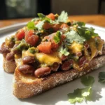 If you’re looking for a quick, nutritious, and satisfying meal that can be enjoyed at any time of the day, look no further than Cheesy Masala Beans on Toast. This delectable dish brings together the humble comfort of beans on toast with the vibrant, aromatic spices of Indian cuisine, creating an irresistible fusion that tantalizes the taste buds. Whether you’re in need of a hearty breakfast, a filling lunch, or a cozy dinner, this recipe checks all the boxes. With its rich flavors and creamy texture, Cheesy Masala Beans on Toast has become a favorite among food enthusiasts and is sure to become a staple in your kitchen.